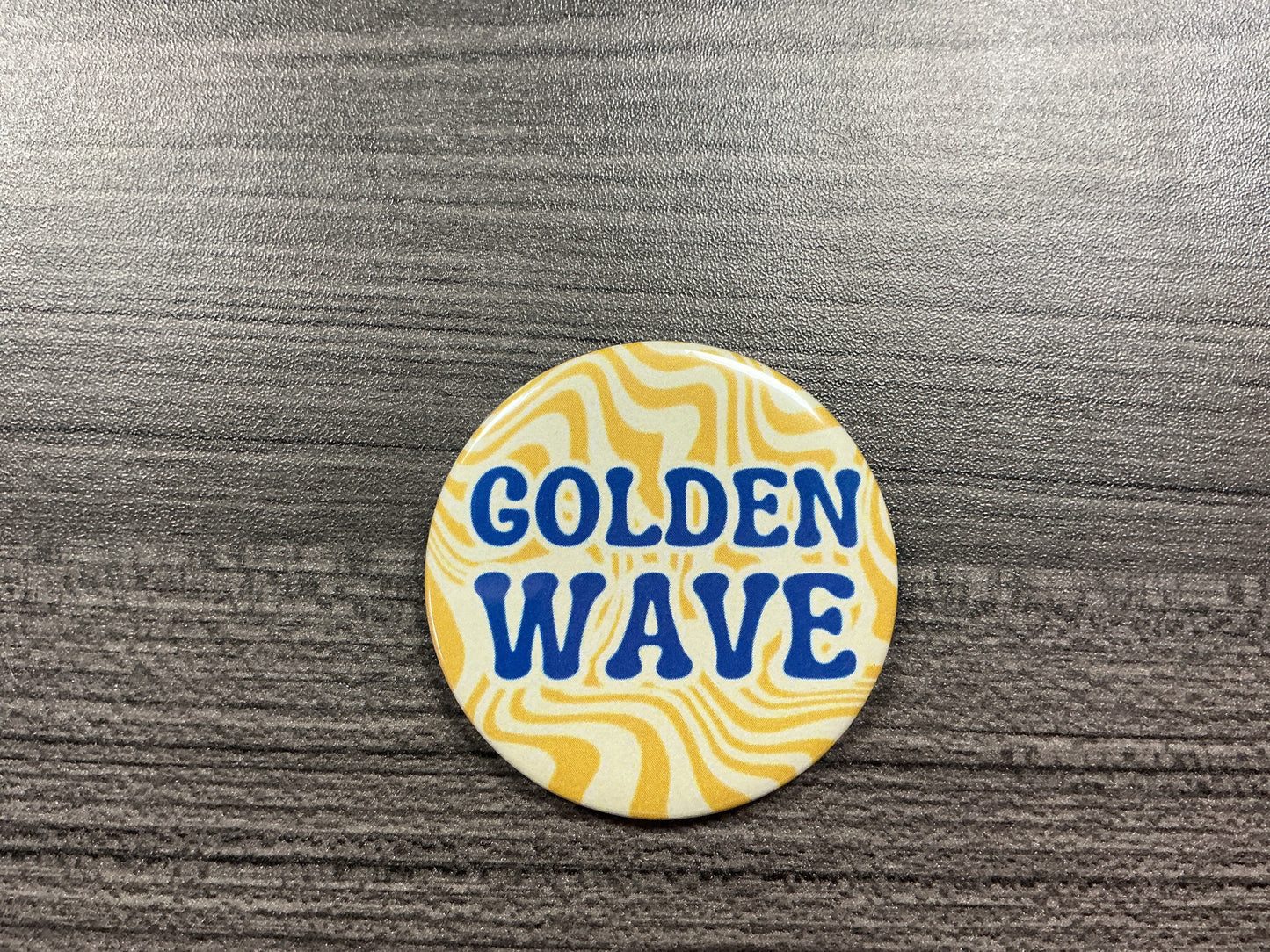 Golden wave button
